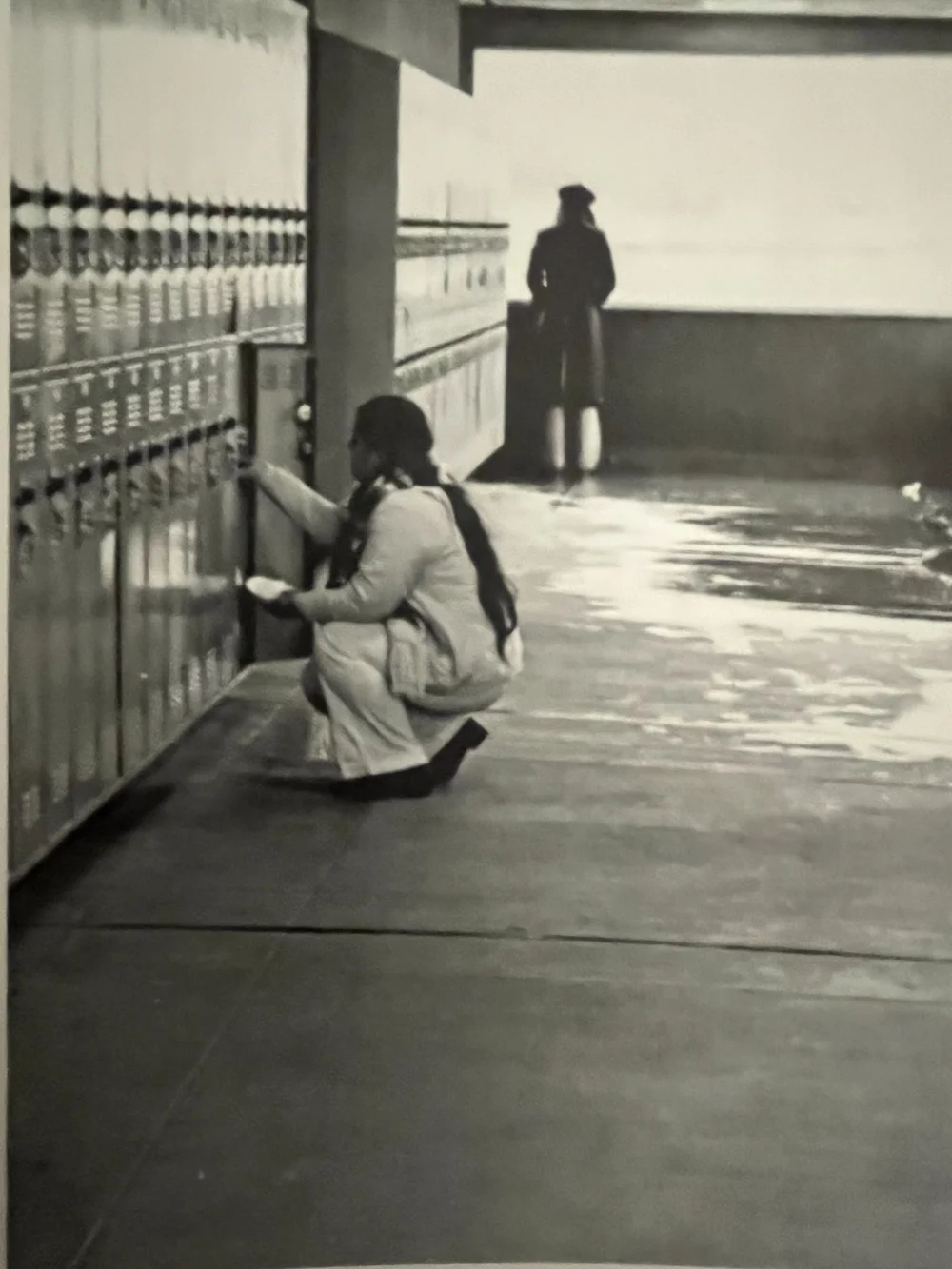 An archival photograph of students beside the lockers at Kennedy High School